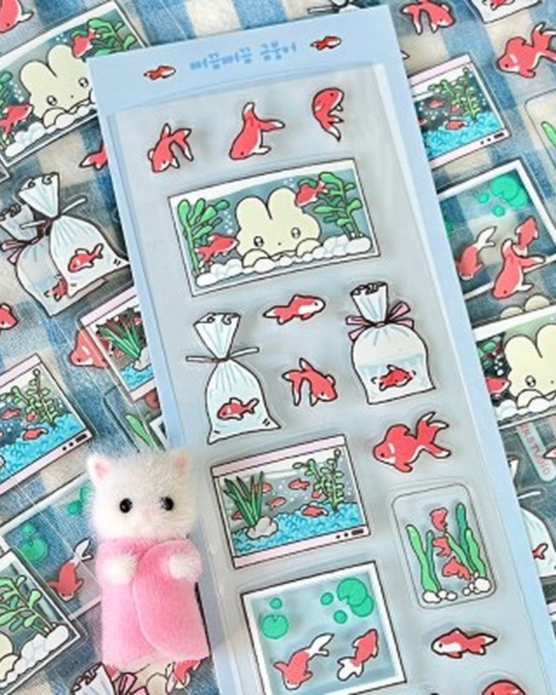 "meta_description": "Enhance your crafts with a Peeking Goldfish Transparent Sticker. Perfect for creative projects!",