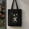 "Astronaut caching stars " Premium Tote Bag Natural