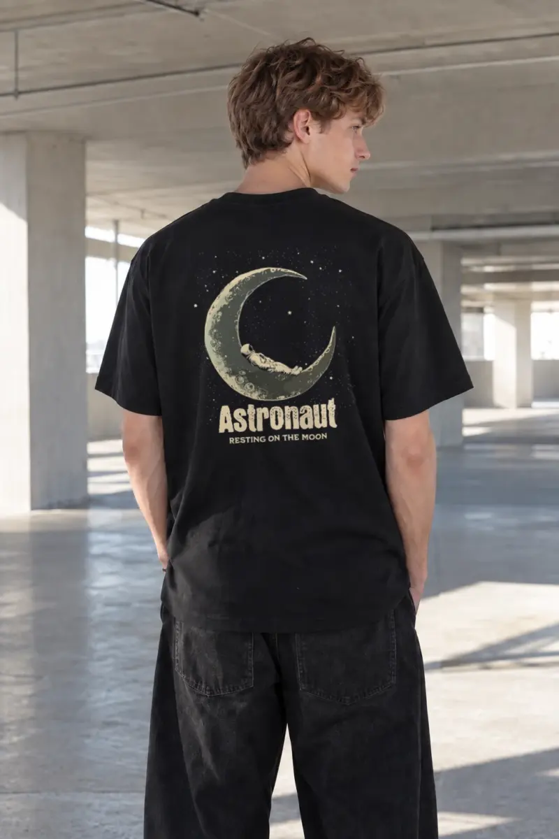 “Astronaut Resting Moon” Heavyweight Unisex Crewneck T-shirt | Gildan 5000