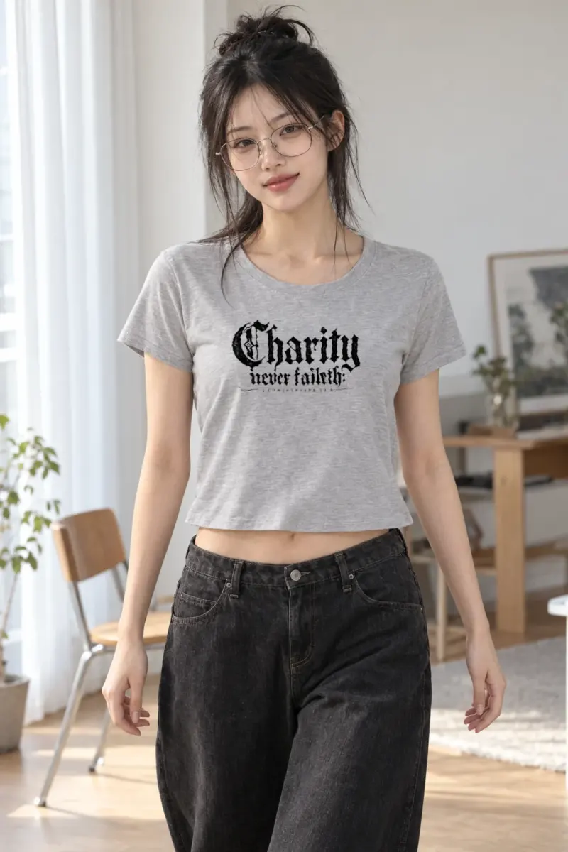 “Charity never faileth: 1 CORINTHIANS 13:8” Women’s Crop Tee