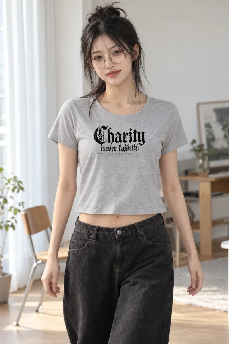 “Charity never faileth: 1 CORINTHIANS 13:8” Women’s Crop Tee