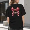 "Ho Ho Ho Ribbon" Heavyweight Unisex Crewneck T-shirt | Gildan 5000