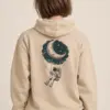 "Moon Swing Astronaut" Heavy Blend Unisex Pullover Hoodie