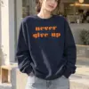 "Never Give Up" Heavy Blend Unisex Crewneck Sweatshirt | Gildan 18000