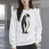 "Penguin Water Reflection" Heavy Blend Unisex Crewneck Sweatshirt | Gildan 18000