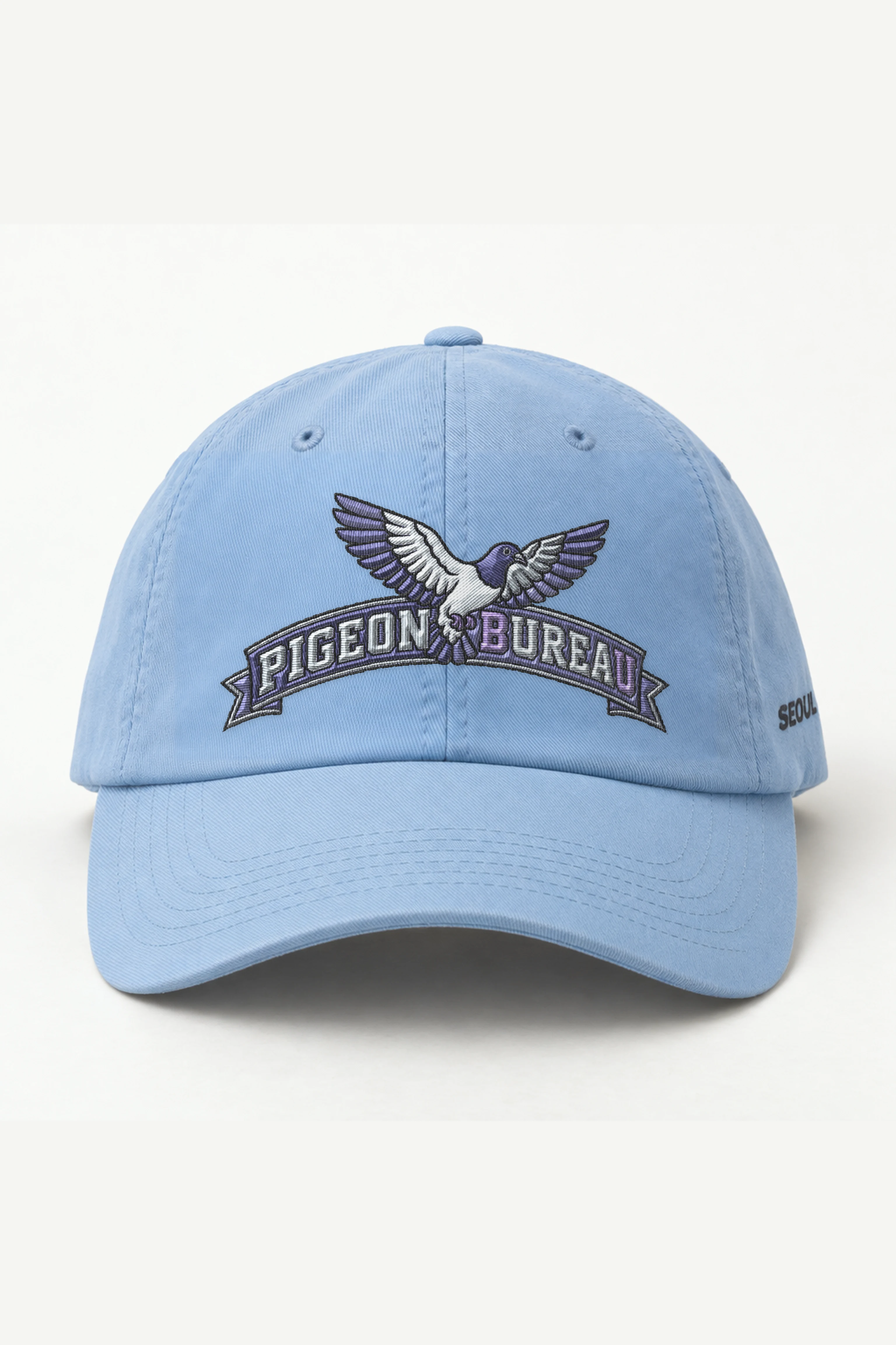 "Pigeon Bureau" Classic Dad Hat · Embroidered — light-blue/cap-front