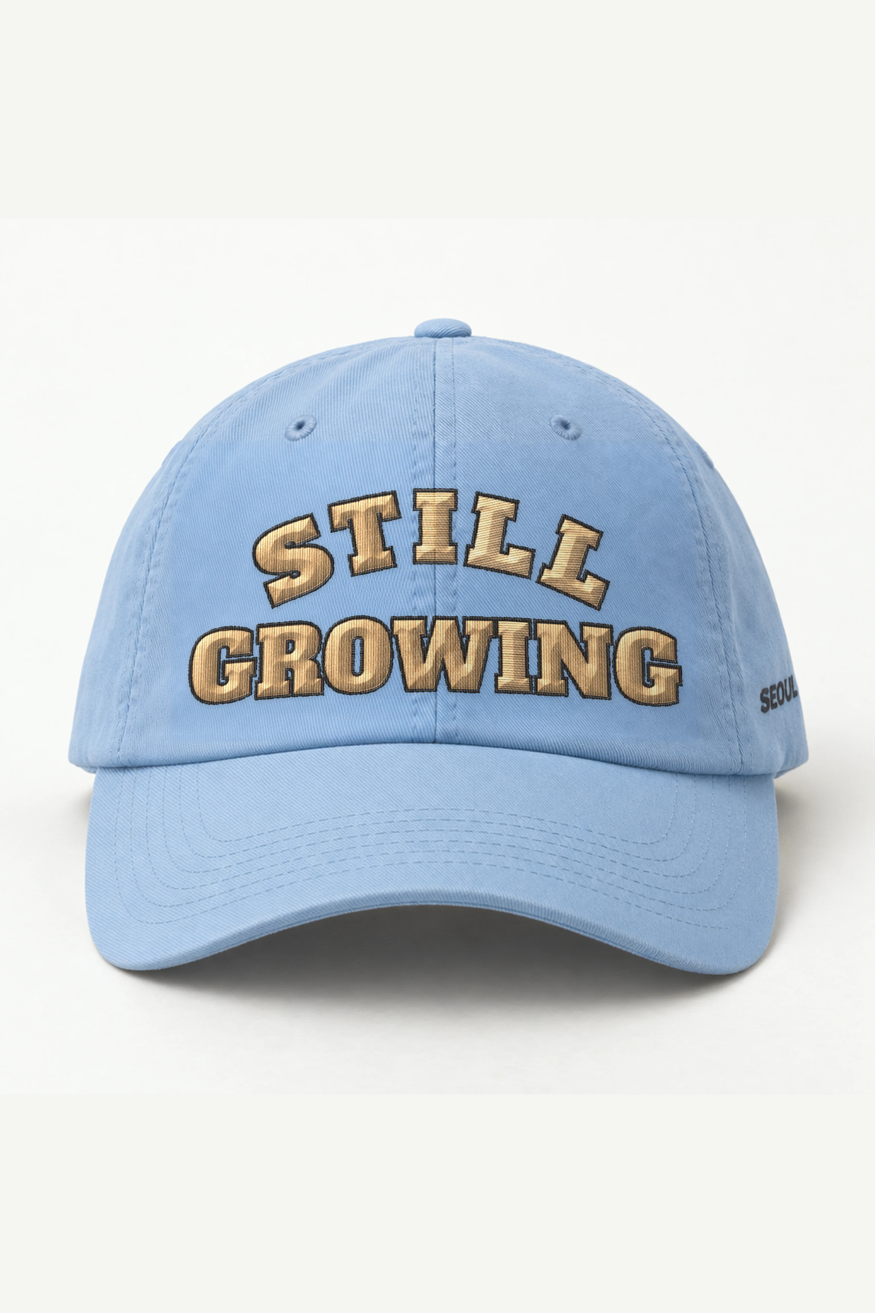 "Still Growing" Classic Dad Hat · Embroidered — light-blue/cap-front