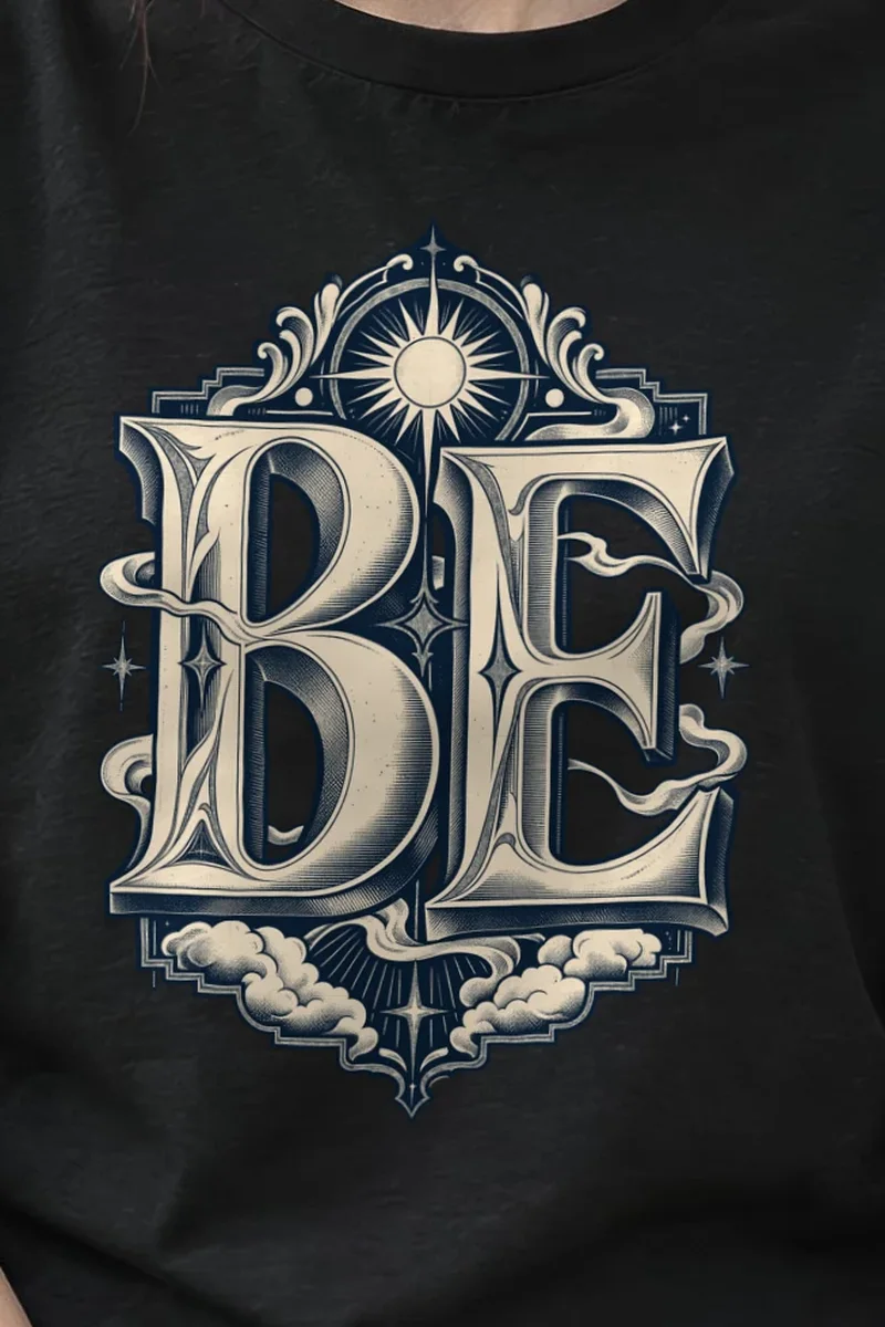 "BE" Heavyweight Unisex Crewneck T-shirt - the graphic up close