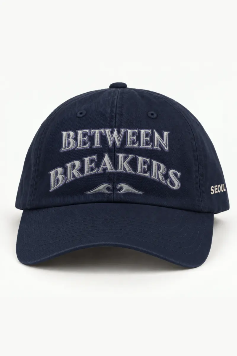 "Between Breakers" Classic Dad Hat · Embroidered — navy/cap-front
