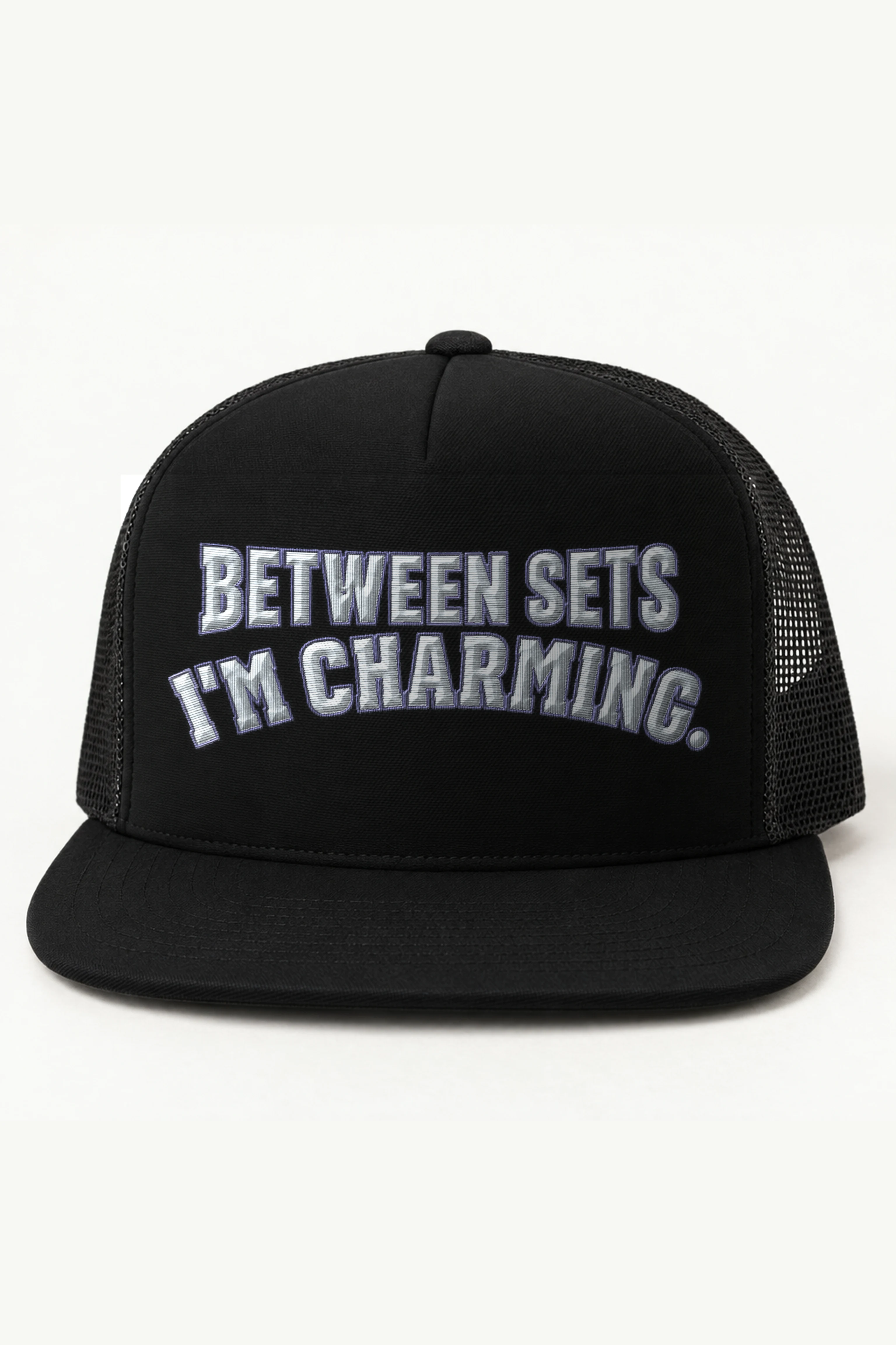 "Between Sets I'm Charming" 5 Panel Trucker Cap · Embroidered