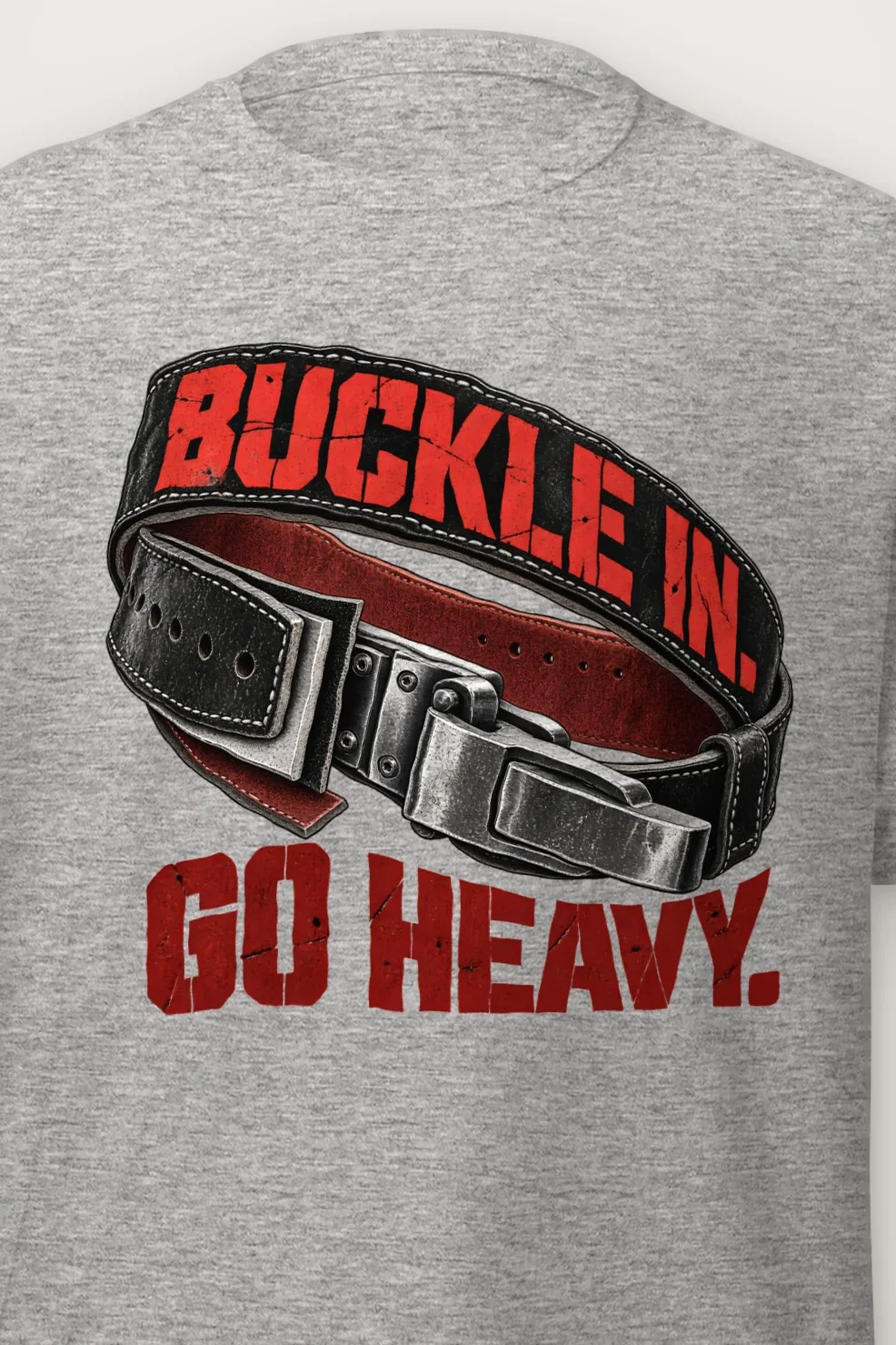 "Buckle In. Go Heavy." Heavyweight Unisex Crewneck T-shirt - the graphic up close