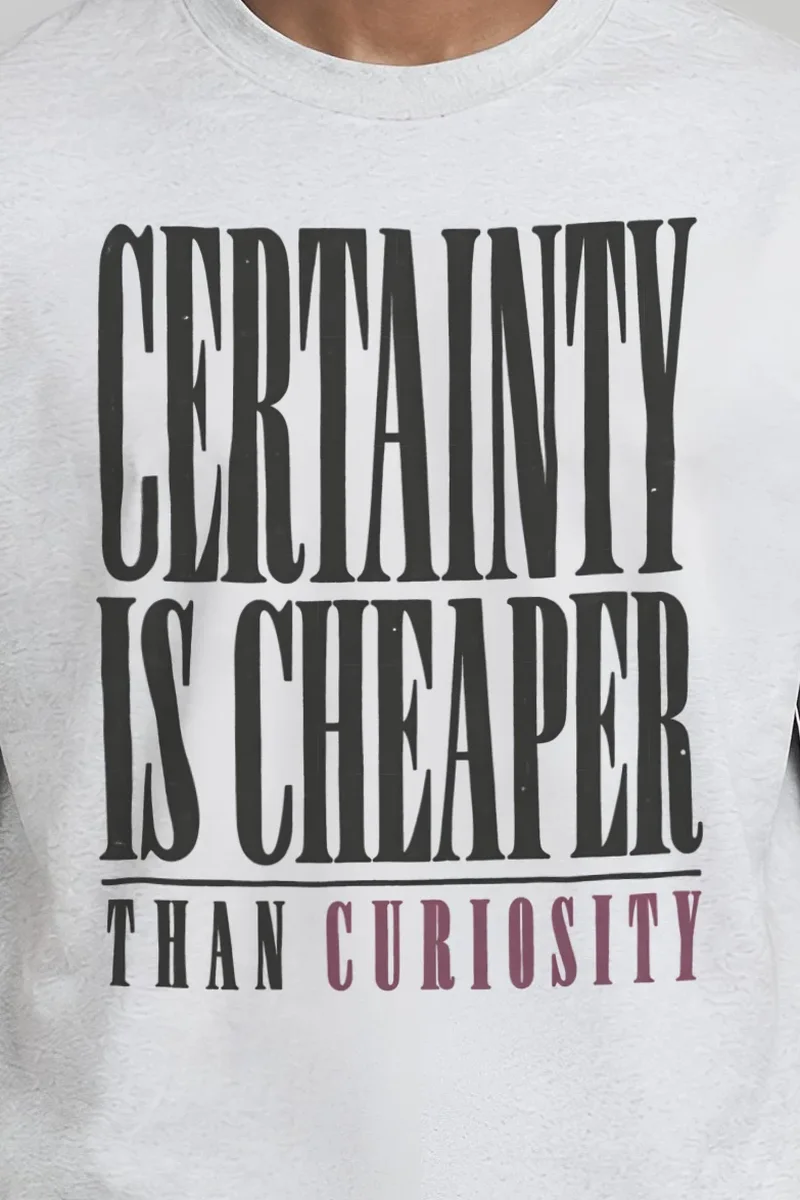 "Certainty Is Cheaper Than Curiosity" Heavyweight Unisex Crewneck T-shirt - the graphic up close