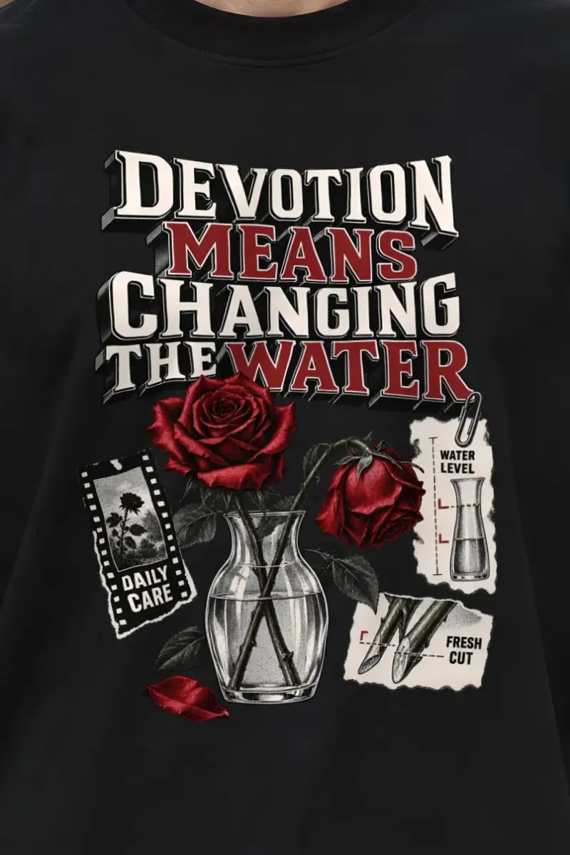 "Devotion Means Changing the Water" Men’s Oversized Heavyweight Crewneck T-Shirt - the graphic up close