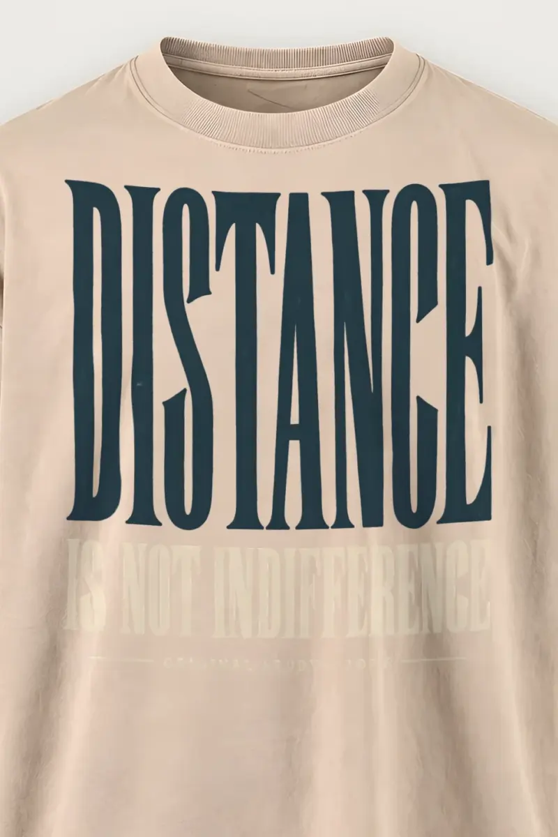 "Distance Is Not Indifference" Men’s Oversized Heavyweight Crewneck T-Shirt - the graphic up close