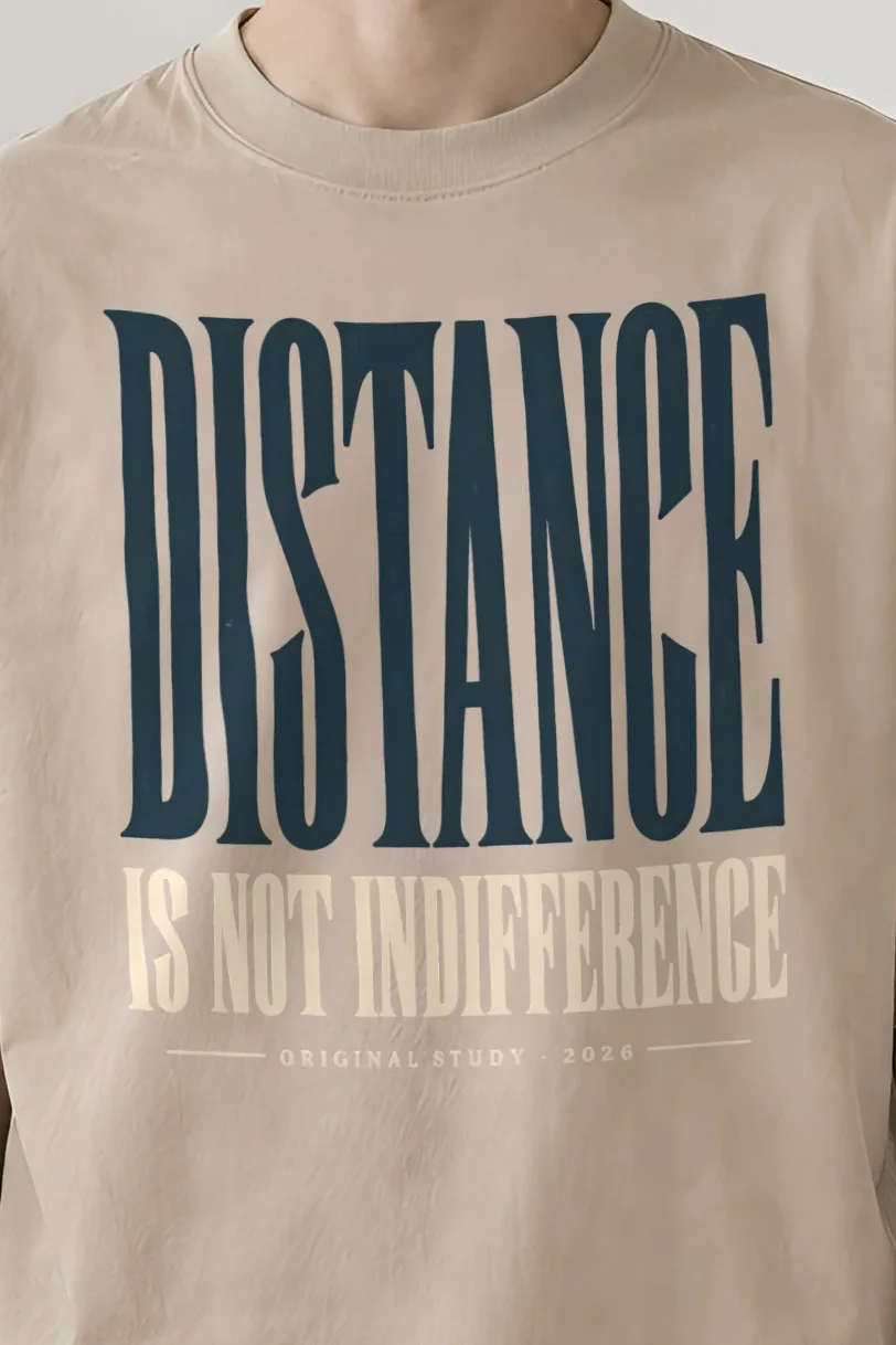 "Distance Is Not Indifference" Men’s Oversized Heavyweight Crewneck T-Shirt - the graphic up close