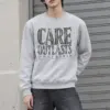 "Distressed Care Ownership Crew" Heavy Blend Unisex Crewneck Sweatshirt