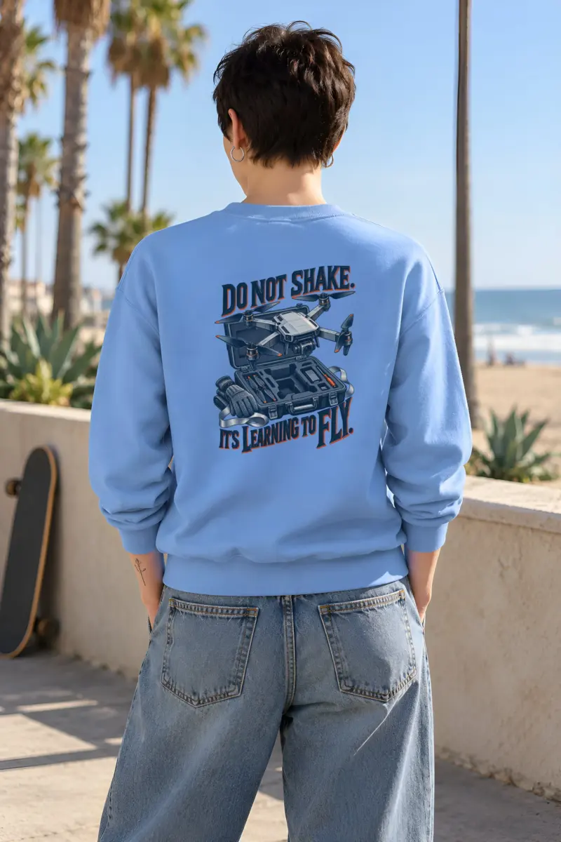 "Do Not Shake, Learning to Fly" Heavy Blend Unisex Crewneck Sweatshirt