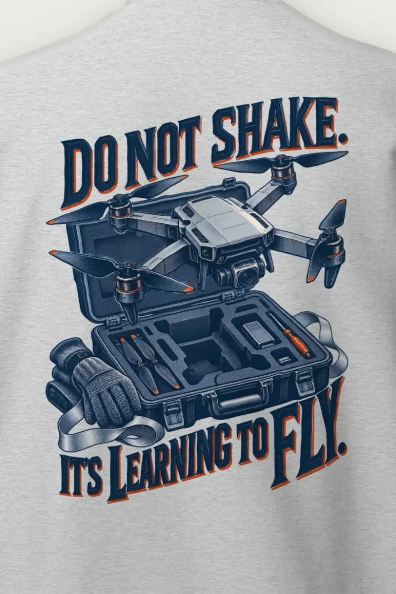 "Do Not Shake, Learning to Fly" Heavy Blend Unisex Crewneck Sweatshirt - the graphic up close