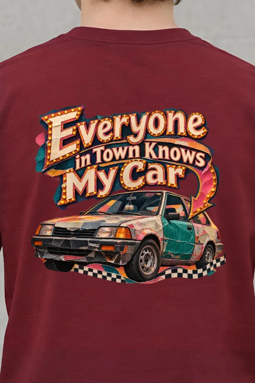 "Everyone in Town Knows My Car" Heavyweight Unisex Crewneck T-shirt - the graphic up close