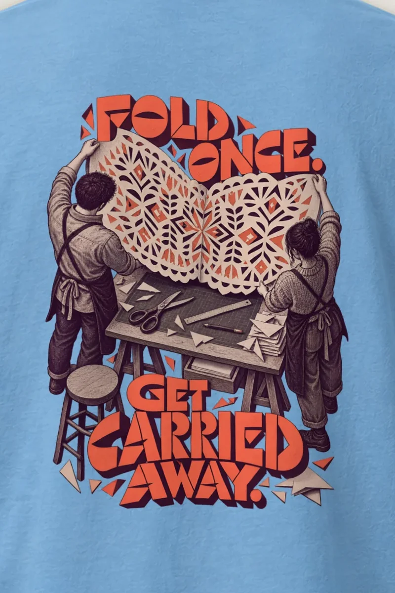 "Fold Once Get Carried Away" Heavyweight Unisex Crewneck T-shirt - the graphic up close