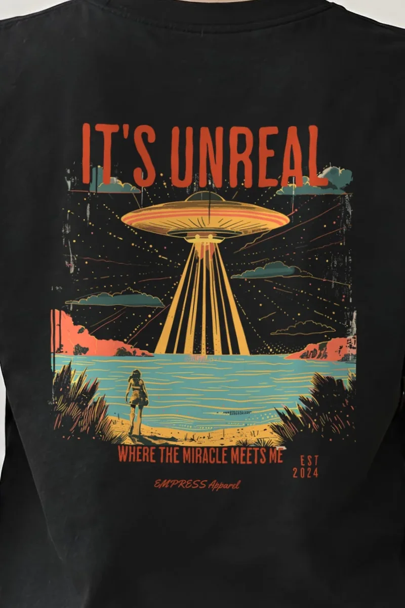 "It’s Unreal" Heavyweight Unisex Crewneck T-shirt - the graphic up close