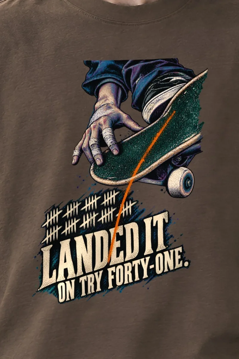 "Landed It" Unisex Oversized Heavyweight Crewneck T-Shirt - the graphic up close