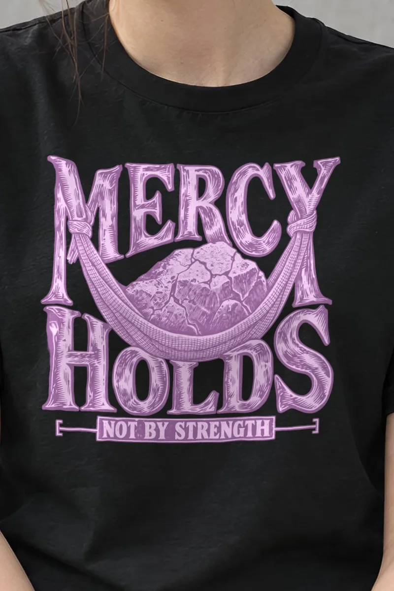 "Mercy Holds Not by Strength" Heavyweight Unisex Crewneck T-shirt - the graphic up close