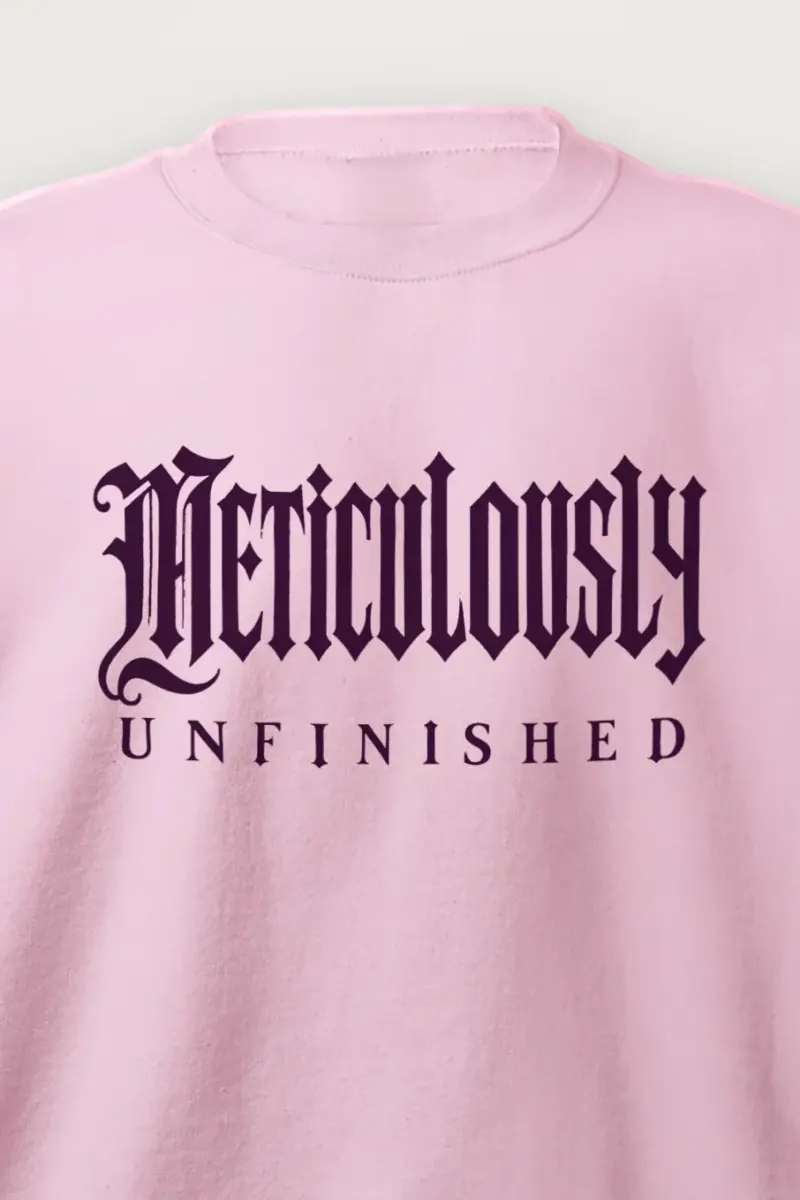 "Meticulously Unfinished" Heavy Blend Unisex Crewneck Sweatshirt - the graphic up close