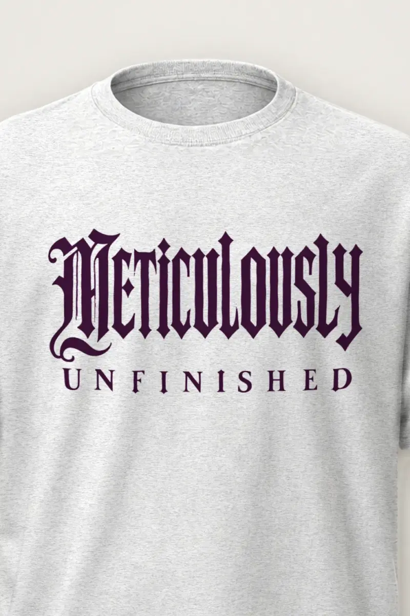 "Meticulously UNFINISHED" Heavyweight Unisex Crewneck T-shirt - the graphic up close