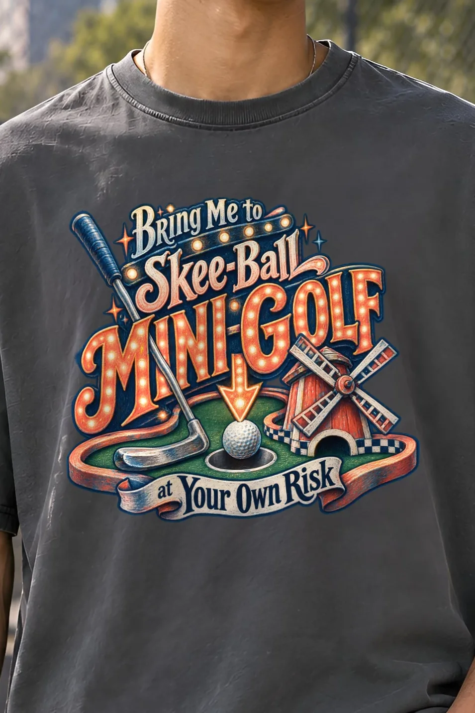 "Mini-Golf at Your Own Risk" Unisex Oversized Heavyweight Crewneck T-Shirt - the graphic up close