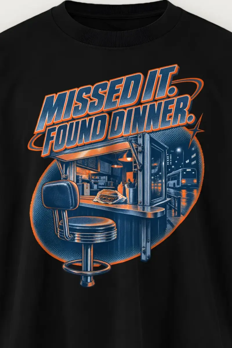 "Missed It. Found Dinner." Men’s Oversized Heavyweight Crewneck T-Shirt - the graphic up close