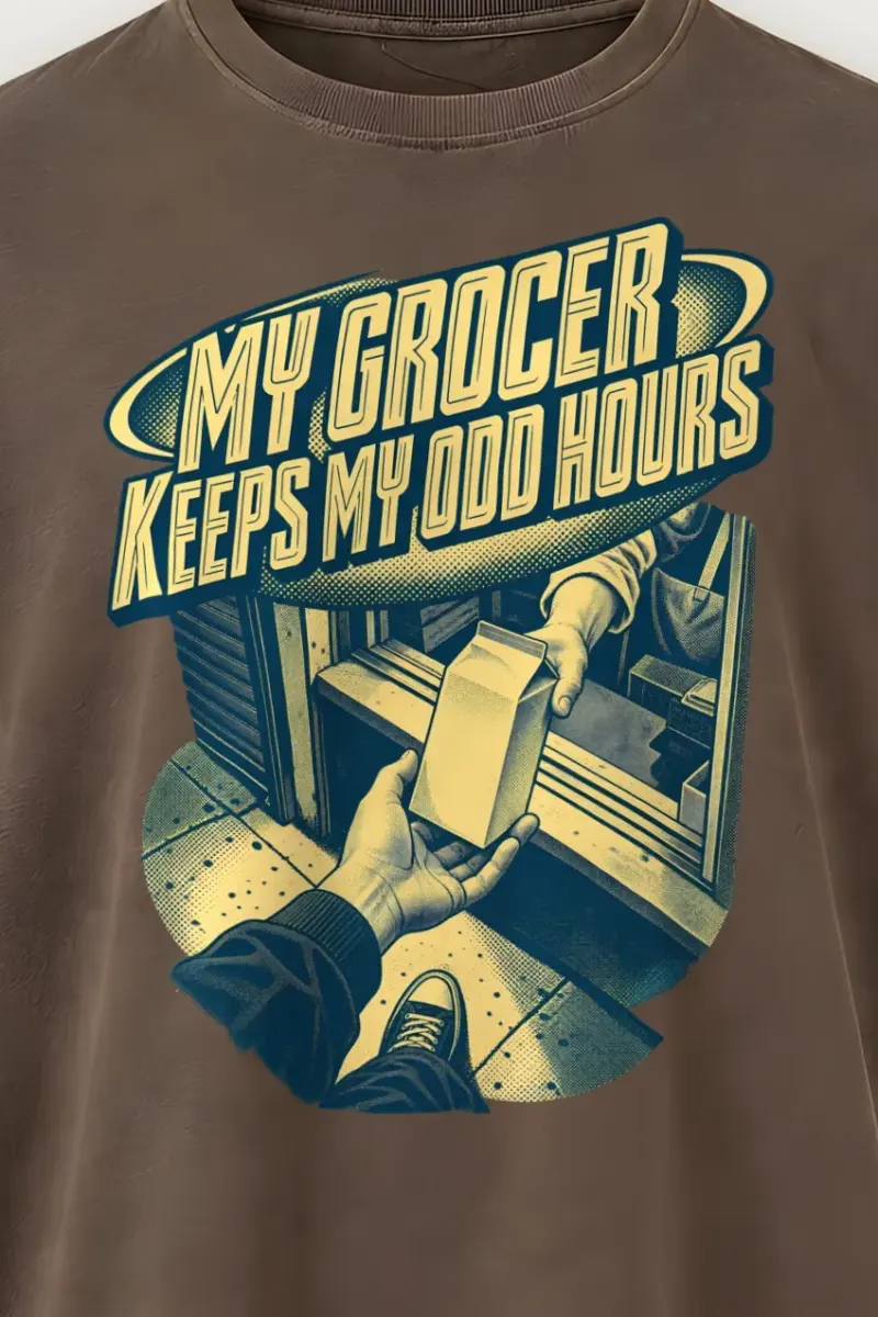 "MY GROCER KEEPS MY ODD HOURS" Men’s Oversized Heavyweight Crewneck T-Shirt - the graphic up close