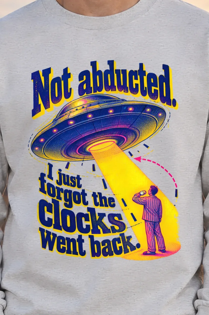 "Not Abducted Clocks Went Back" Unisex Longsleeve T-shirt - the graphic up close