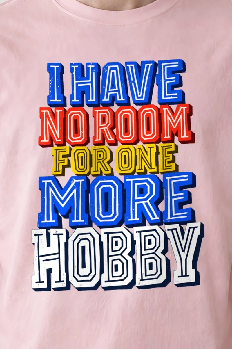"One More Hobby" Heavyweight Unisex Crewneck T-shirt - the graphic up close