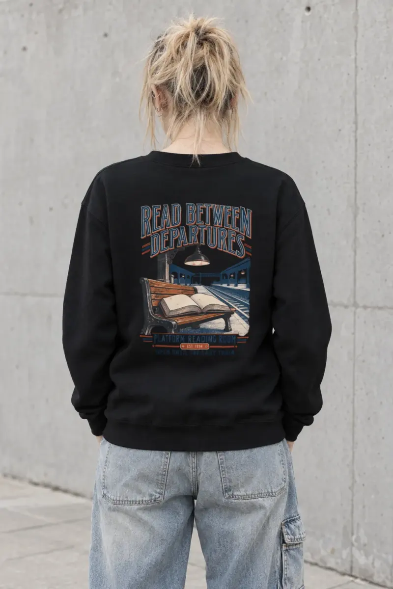 "READ BETWEEN DEPARTURES" Heavy Blend Unisex Crewneck Sweatshirt