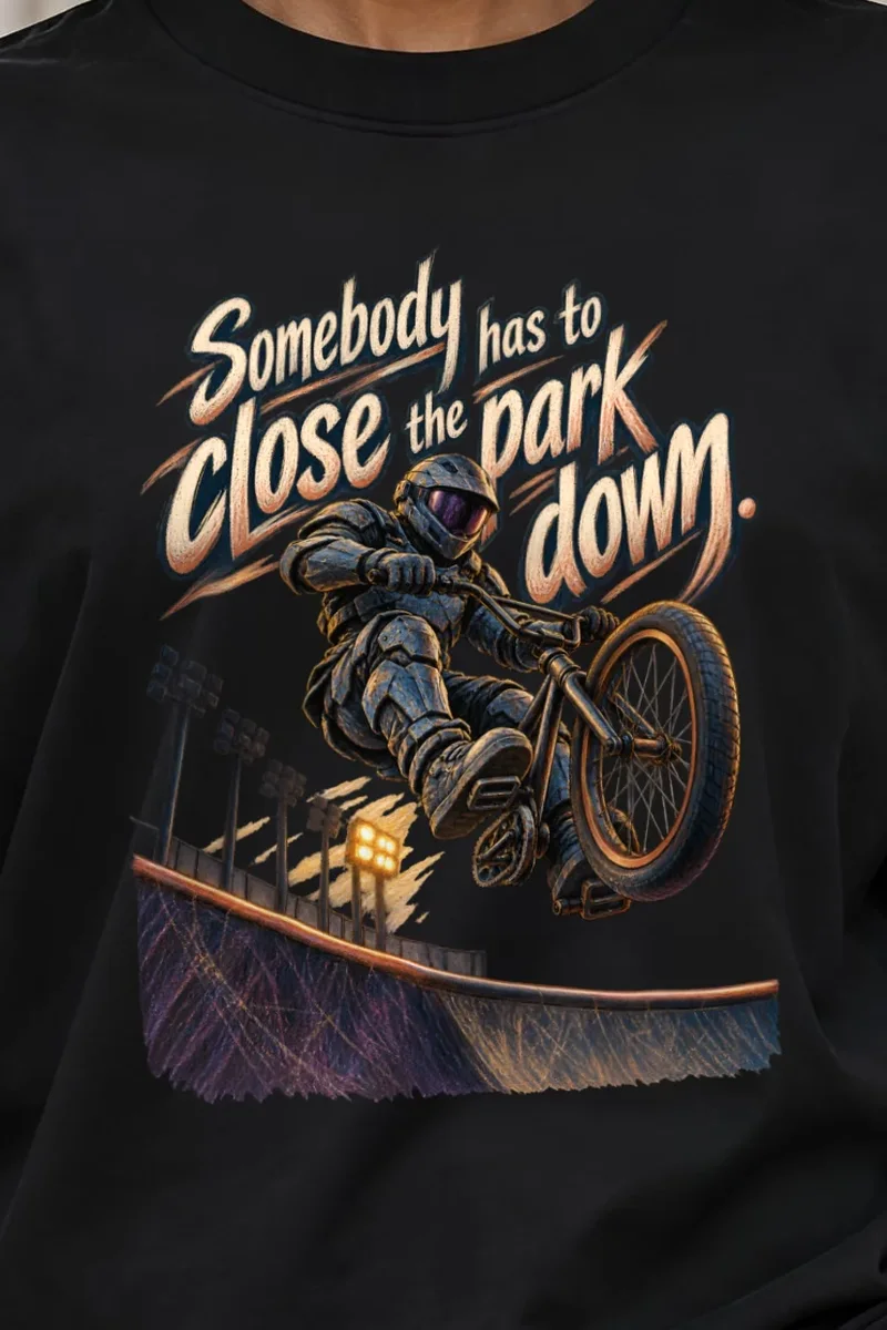 "Somebody Has to Close the Park Down" Unisex Oversized Heavyweight Crewneck T-Shirt - the graphic up close