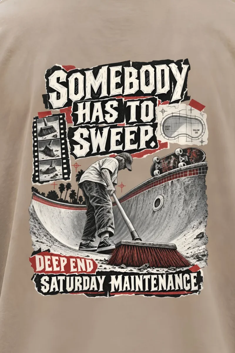 "Somebody Has To Sweep" Men’s Oversized Heavyweight Crewneck T-Shirt - the graphic up close