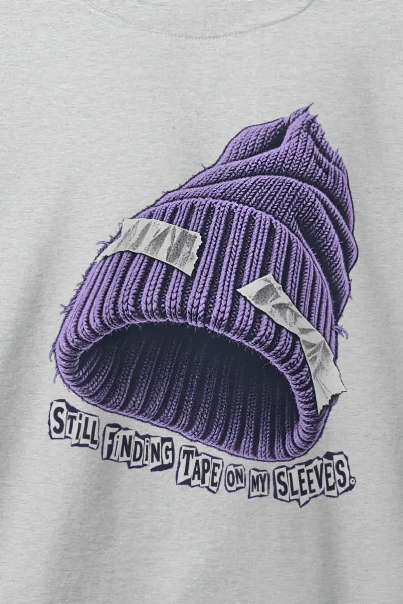"Still Finding Tape On My Sleeves." Heavy Blend Unisex Crewneck Sweatshirt - the graphic up close