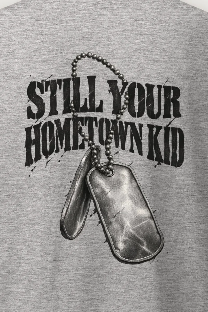 "Still Your Hometown Kid" Heavyweight Unisex Crewneck T-shirt - the graphic up close