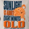 "Sunlight Is About Eight Minutes Old" Heavyweight Unisex Crewneck T-shirt - the graphic up close