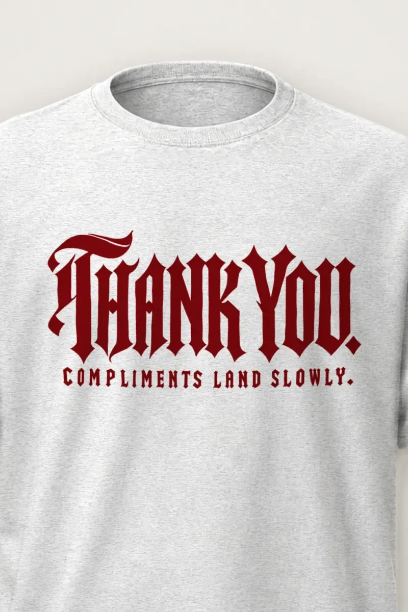 "Thank You. Compliments Land Slowly." Heavyweight Unisex Crewneck T-shirt - the graphic up close
