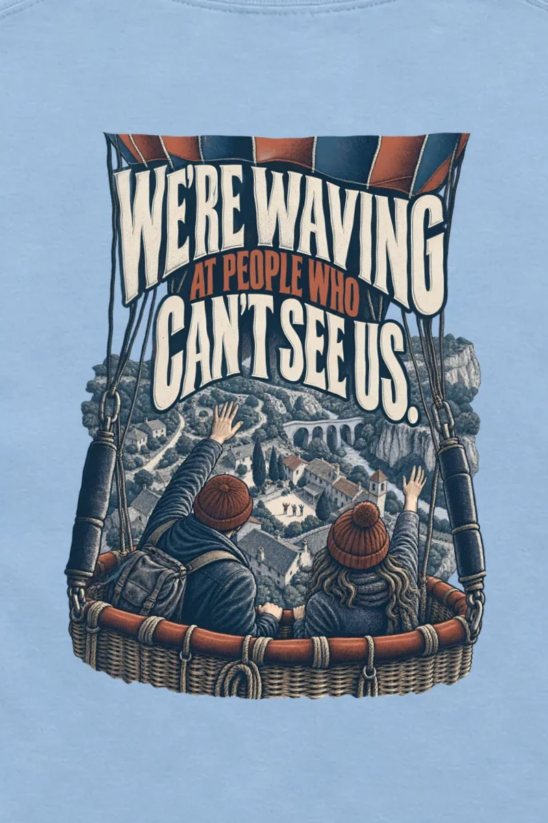 "Waving From the Balloon" Unisex Longsleeve T-shirt - the graphic up close