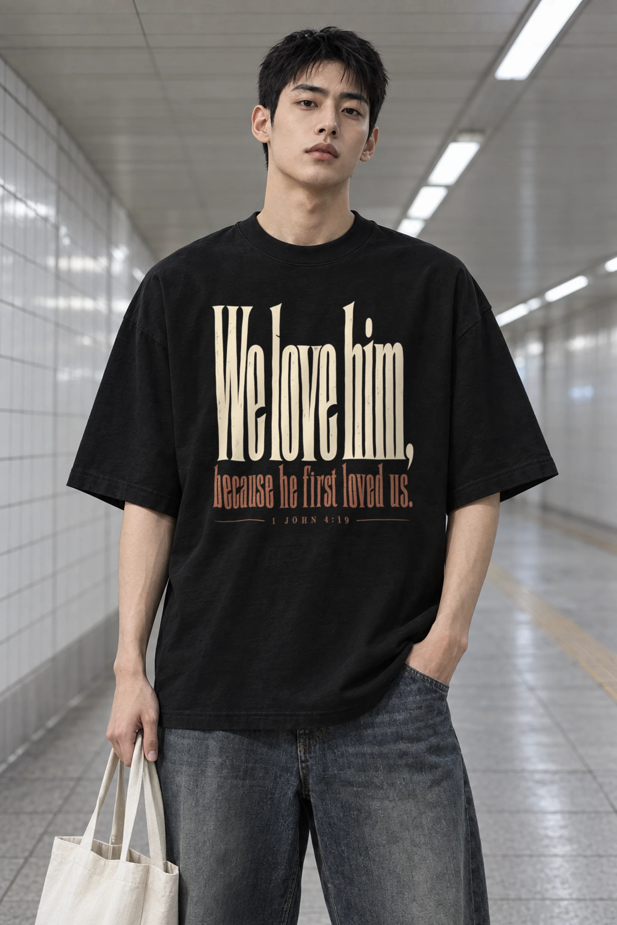 "We Love Him, Because He First Loved Us." Men's Oversized Heavyweight Crewneck T-Shirt