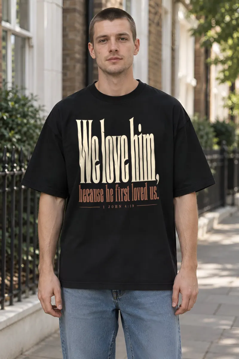 "We Love Him, Because He First Loved Us." Unisex Oversized Heavyweight Crewneck T-Shirt