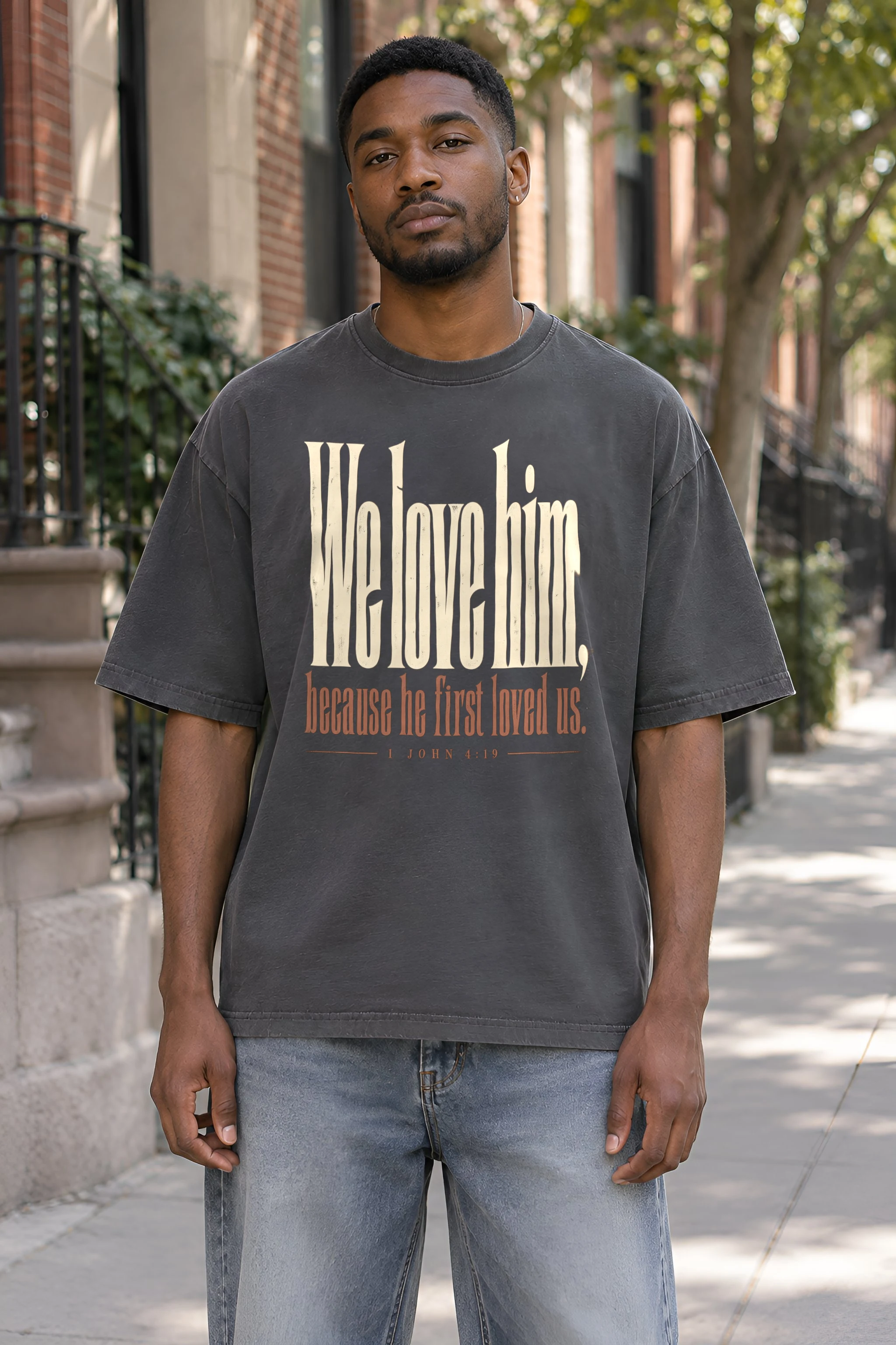 "We Love Him, Because He First Loved Us." Unisex Oversized Heavyweight Crewneck T-Shirt