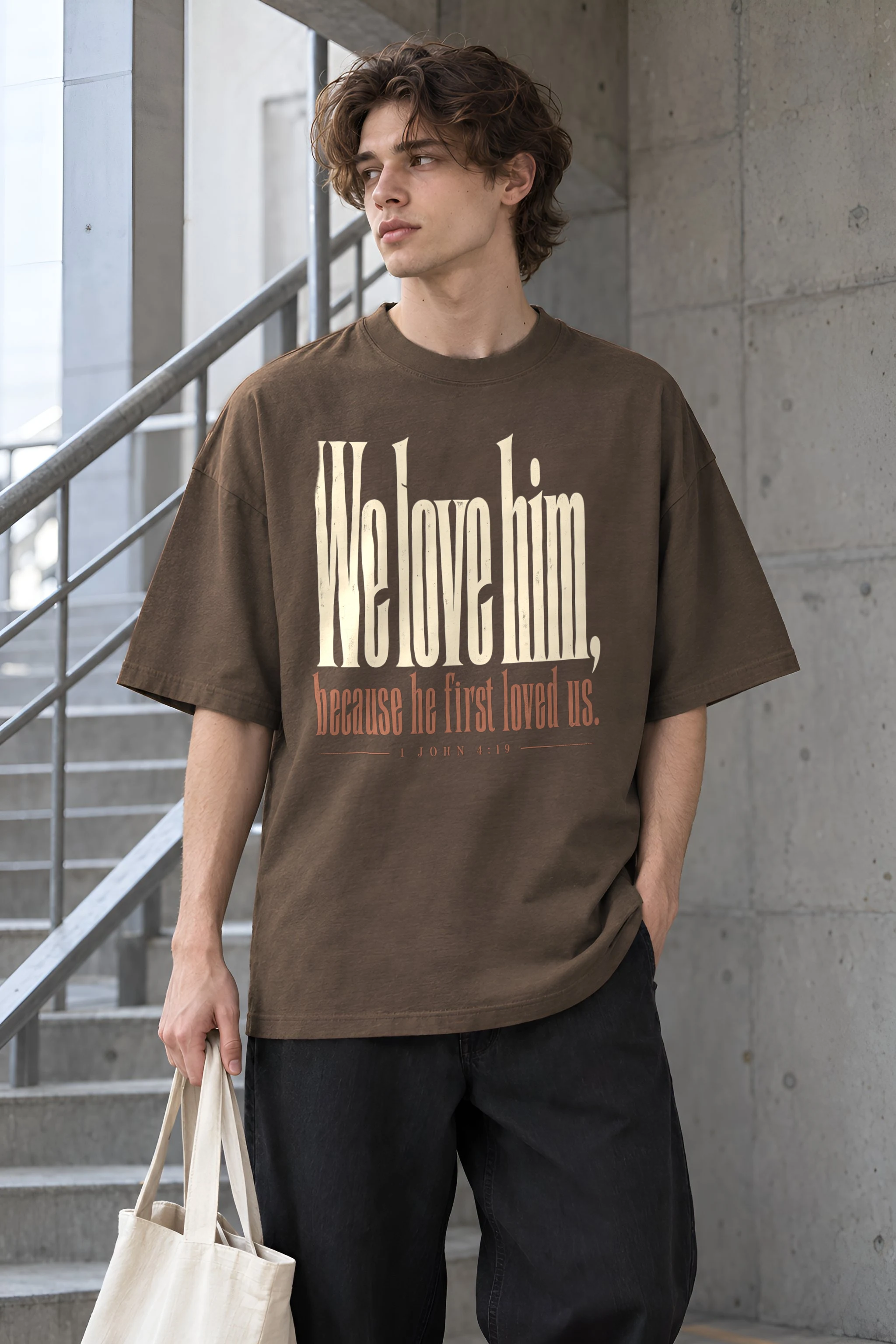 "We Love Him, Because He First Loved Us." Unisex Oversized Heavyweight Crewneck T-Shirt