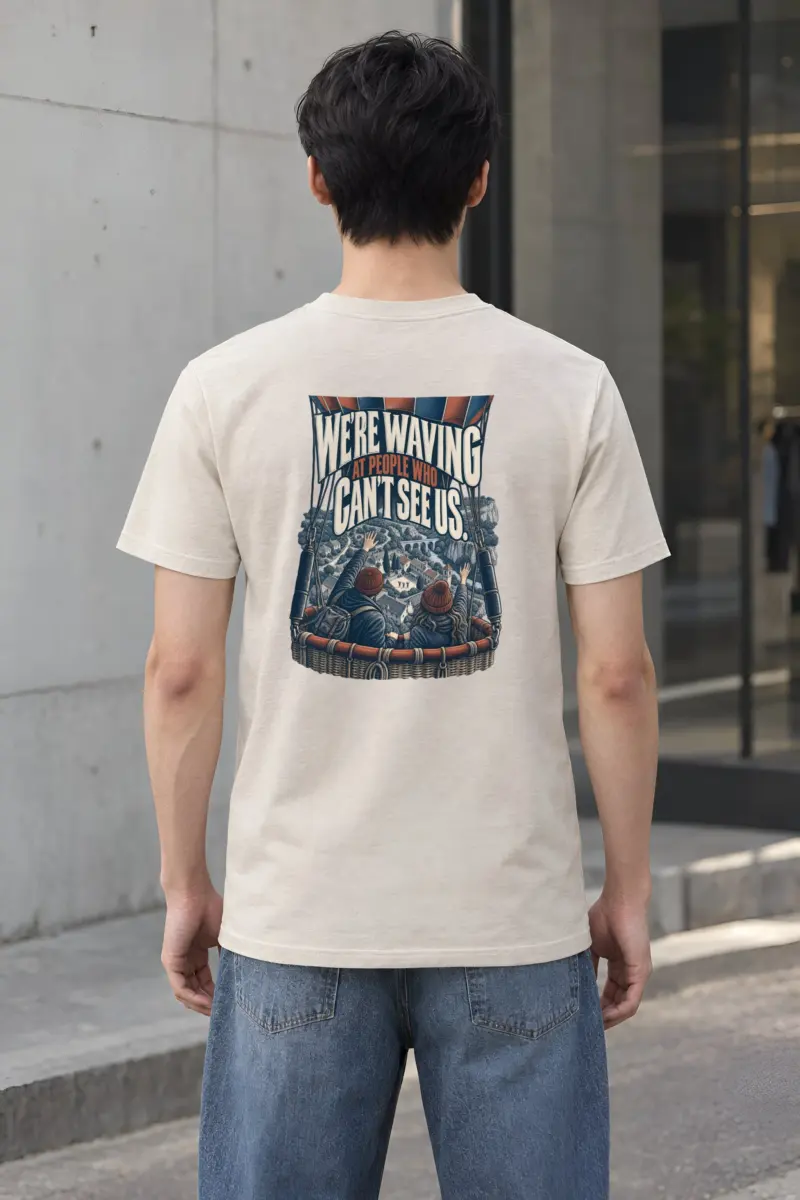 “We’re Waving At People Who Can’t See Us” Heavyweight Unisex Crewneck T-shirt