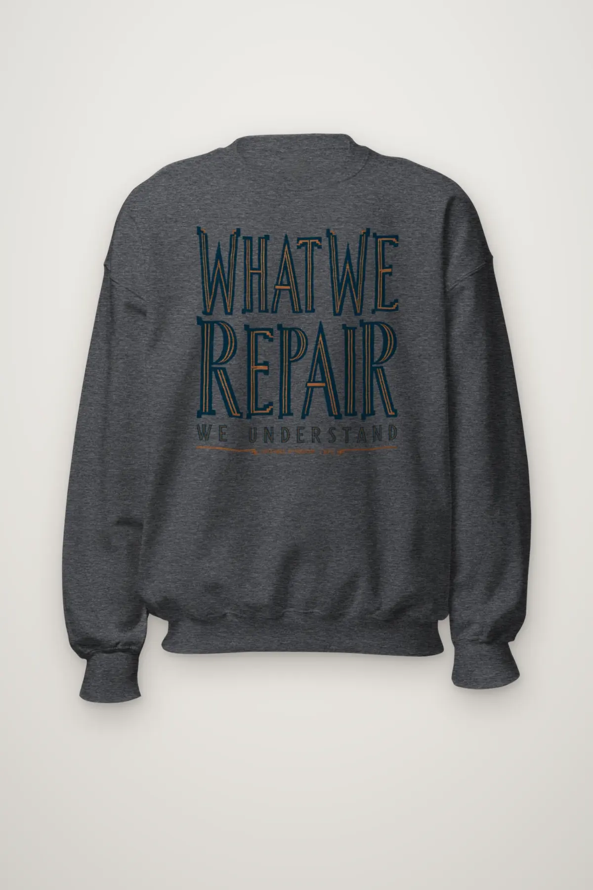"What We Repair We Understand" Heavy Blend Unisex Crewneck Sweatshirt