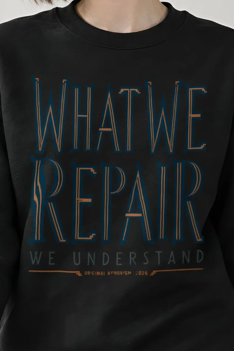 "What We Repair We Understand" Heavy Blend Unisex Crewneck Sweatshirt - the graphic up close