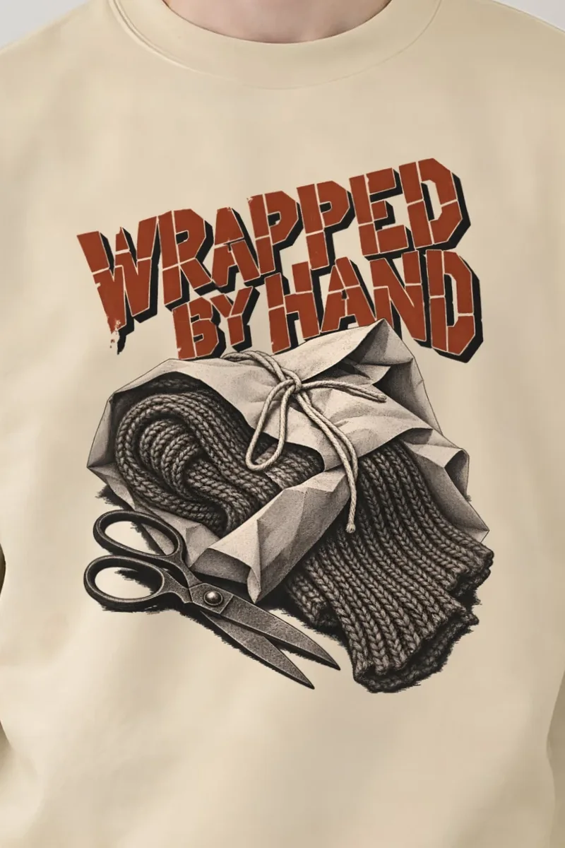 "Wrapped by Hand" Heavy Blend Unisex Crewneck Sweatshirt - the graphic up close